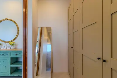 a dressing room with a mirror and a door at V255 Huge Brand-New 7BR Pool Villa Rooftop View in Kata Beach