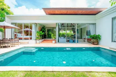 a swimming pool in the backyard of a house at Private 3BR Villa trichad Airport and Maid in Phuket Town