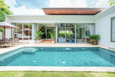 a swimming pool in the backyard of a house at Private 3BR Villa trichad Airport and Maid in Phuket Town