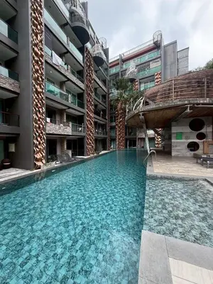 a swimming pool in the middle of a building at Emerald Terrace Resort 622 in Patong Beach