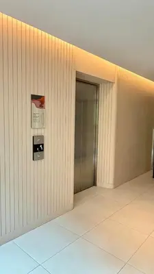 an empty hallway with a door in a building at Cozy apartments for a comfortable stay and accommodation in Phuket Town