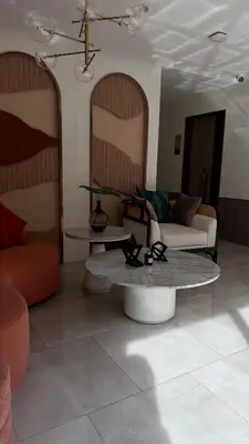 a living room with a couch and a table at Cozy apartments for a comfortable stay and accommodation in Phuket Town