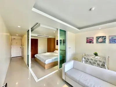 a bedroom with a bed and a mirror at Pingping&FamilyAonang-2 in Ban Khlong Son