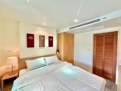 a bedroom with a large white bed in it at Pingping&FamilyAonang-2 in Ban Khlong Son