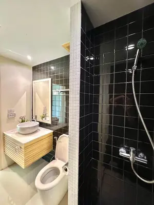 a bathroom with a toilet and a sink and a shower at Pingping&FamilyAonang-2 in Ban Khlong Son