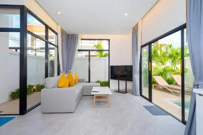 a living room with a couch and a table at Villa Serana - New Private Pool Villa in Goldena Residence, Kamala in Kamala Beach