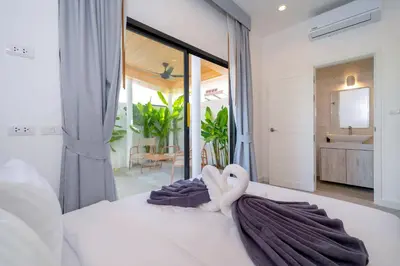 a bedroom with a bed with a towel on it at Villa Serana - New Private Pool Villa in Goldena Residence, Kamala in Kamala Beach