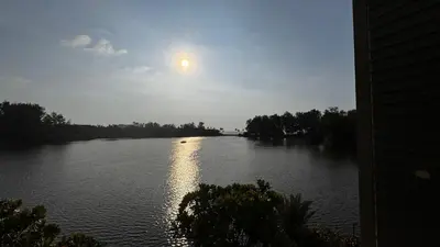 a river with the sun reflecting on the water at Cassia Sea and Pool view 2bd apartments by Aster in Laguna Phuket