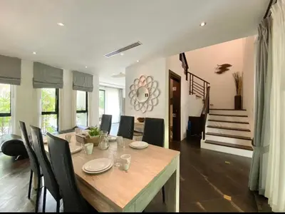 a dining room with a table and chairs at Villa Nature village kamala in Kamala Beach