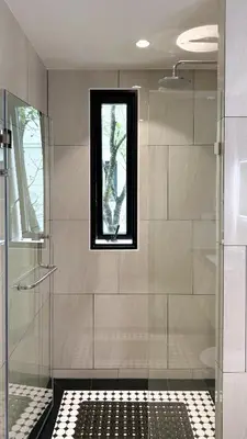 a bathroom with a shower and a window at Stylish Pool View Apartments Legendary Bangtao by Mango Family in Bang Tao Beach