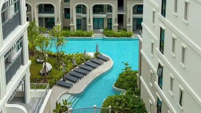 an aerial view of a swimming pool in a resort at Stylish Pool View Apartments Legendary Bangtao by Mango Family in Bang Tao Beach