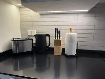 a counter top with a coffee maker and a paper towels at The Title Legendary Bang Tao by Tropicana Property in Bang Tao Beach