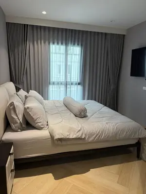 a bed with pillows on it in a bedroom at The Title Legendary Bang Tao by Tropicana Property in Bang Tao Beach