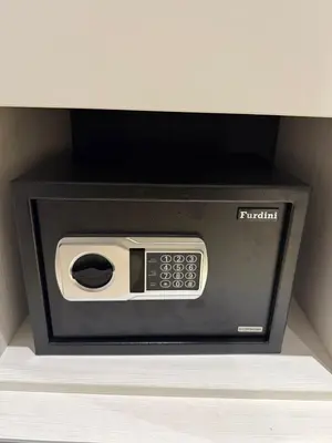 a microwave oven with a tv on a shelf at The Title Legendary Bang Tao by Tropicana Property in Bang Tao Beach