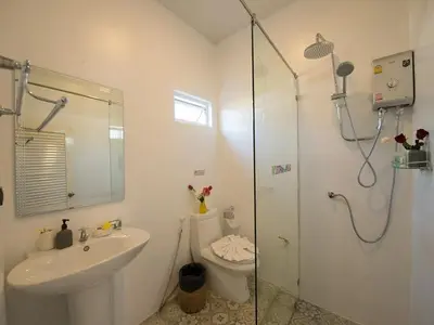 a bathroom with a toilet and a sink and a shower at Bora Bora Villa Phuket in Chalong