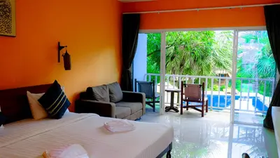 a bedroom with two beds and a living room at Bora Bora Villa Phuket in Chalong