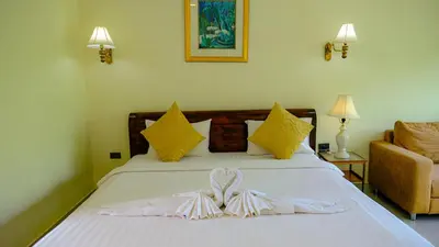 a bedroom with a bed with a bow on it at Bora Bora Villa Phuket in Chalong