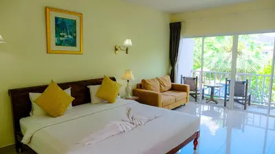 a bedroom with a bed and a living room at Bora Bora Villa Phuket in Chalong