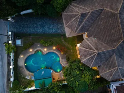 an overhead view of a swimming pool at a resort at Golfer's Getaway 7 Bedroom Pool Villa (SV1) in Phuket Town