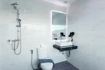 a bathroom with a shower and a toilet and a sink at NEW! 3-Bedroom Pool Villa Overlooking Chalong Bay-Nariya V9 in Chalong