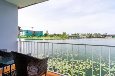 a balcony with a view of a body of water at Chabana Resort Bang-tao Beach Phuket- SHA Extra Plus in Bang Tao Beach