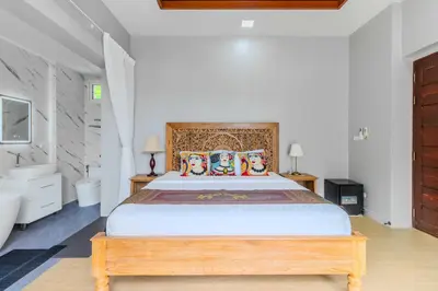 a bedroom with a large bed and a sink at V256 Huge Modern 10BR ZipLine 3 Pools Fully Loaded in Rawai Beach