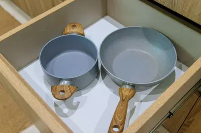 two bowls and wooden utensils sitting in a drawer at V257 Spacious 5BR Villa Waterfall Pool Movie Room in Rawai Beach