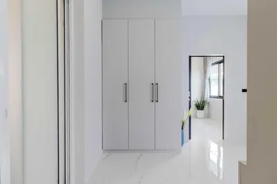 a hallway with white walls and a white door at V258 2 Villas 2 Kitchens 2 Livingrooms Huge Pool in Rawai Beach