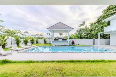 a swimming pool in a backyard with a gazebo at V258 2 Villas 2 Kitchens 2 Livingrooms Huge Pool in Rawai Beach