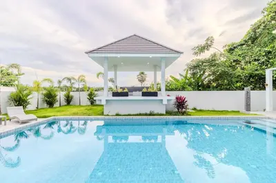 a swimming pool with a gazebo next to a villa at V258 2 Villas 2 Kitchens 2 Livingrooms Huge Pool in Rawai Beach