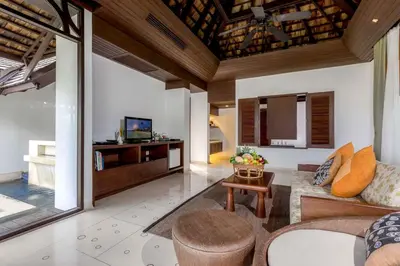a living room with a couch and a table at The Vijitt Resort - Vijitt Pool Villa in Ban Saiyuan (1)
