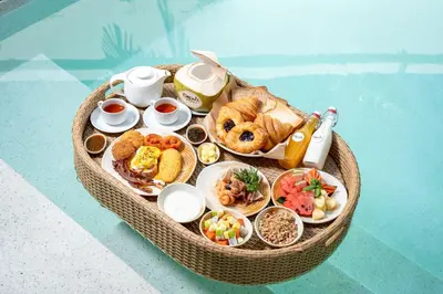 a miniature table of food in a basket at Dewa Villa in Nai Yang Beach
