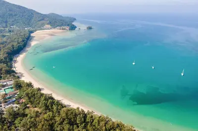 an aerial view of a beach with boats in the water at Naiyang Villa in Nai Yang Beach