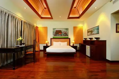 a bedroom with a bed and a desk in a room at Kamala Private Bliss Retreat 4 Bedrooms Villa in Kamala Beach