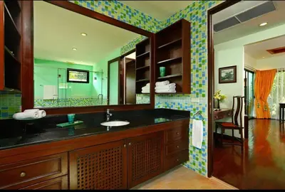 a bathroom with a sink and a mirror at Kamala Private Bliss Retreat 4 Bedrooms Villa in Kamala Beach