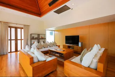 a living room with two couches and a television at Kamala Private Bliss Retreat 4 Bedrooms Villa in Kamala Beach