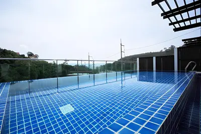 a swimming pool on the roof of a building at Sea View Pool Villa Grand Kamala Falls in Kamala Beach