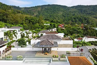 arial view of a house with mountains in the background at 2 Bedroom Villa Janine with Private Pool and Rooftop terrace in Kamala Beach