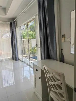 a kitchen with a desk and a chair and a window at Private Tropical Villa 2bdr Bangtao beach in Laguna Phuket