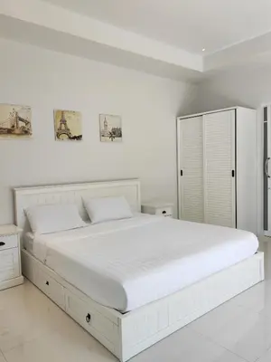 a white bedroom with a large white bed at Private Tropical Villa 2bdr Bangtao beach in Laguna Phuket