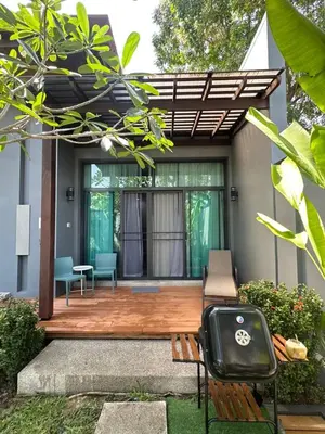 a patio with a bench and a table at Cozy villa - perfect place to stay in Phuket in Ban Saiyuan (1)