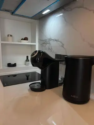 a coffee maker sitting on top of a counter at Kora Beach Studio in Layan Beach
