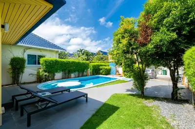 a backyard with a pool and a picnic table at Mediteranean style 3 BR Pool Villa Platinum with garden in Rawai Beach