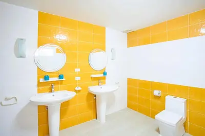 a bathroom with two sinks and a toilet and mirrors at Mediteranean style 3 BR Pool Villa Platinum with garden in Rawai Beach