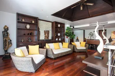 a living room with couches and yellow pillows at 5 BR Villa Kalim 5 Private Pool with Seaview in Patong Beach