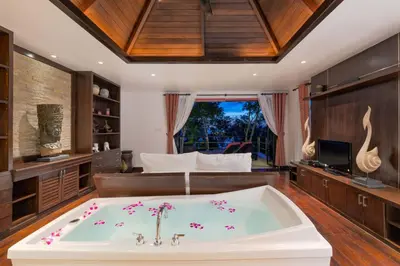 a large bath tub in a room with a bed at 5 BR Villa Kalim 5 Private Pool with Seaview in Patong Beach