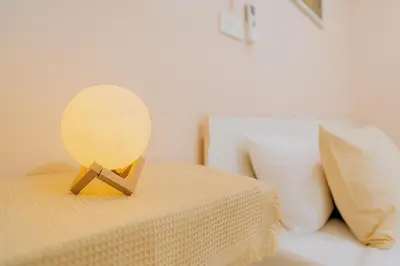 a lamp on top of a bed in a room at Dalbit Heaven #Patong Beach 3 min walk Super Private House 2BR in Patong Beach