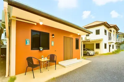 a house with a table and chairs in front of it at Dalbit Heaven #Patong Beach 3 min walk Super Private House 2BR in Patong Beach