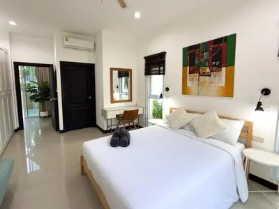 a bedroom with a large white bed in a room at Nai Harn Family Pool Villa 3 BDR by Mill in Ban Saiyuan (1)