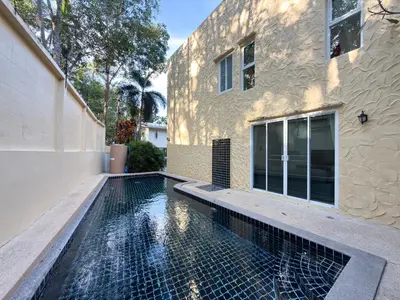 a swimming pool in the backyard of a house at Nai Harn Family Pool Villa 3 BDR by Mill in Ban Saiyuan (1)